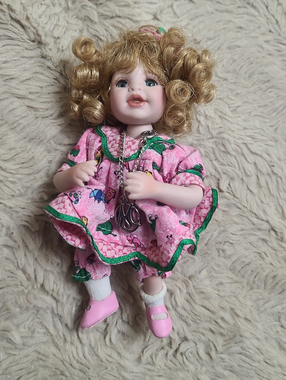 Tinier Tot Marie Osmond Porcelain Curly-Haired Doll in Pink Floral Dress